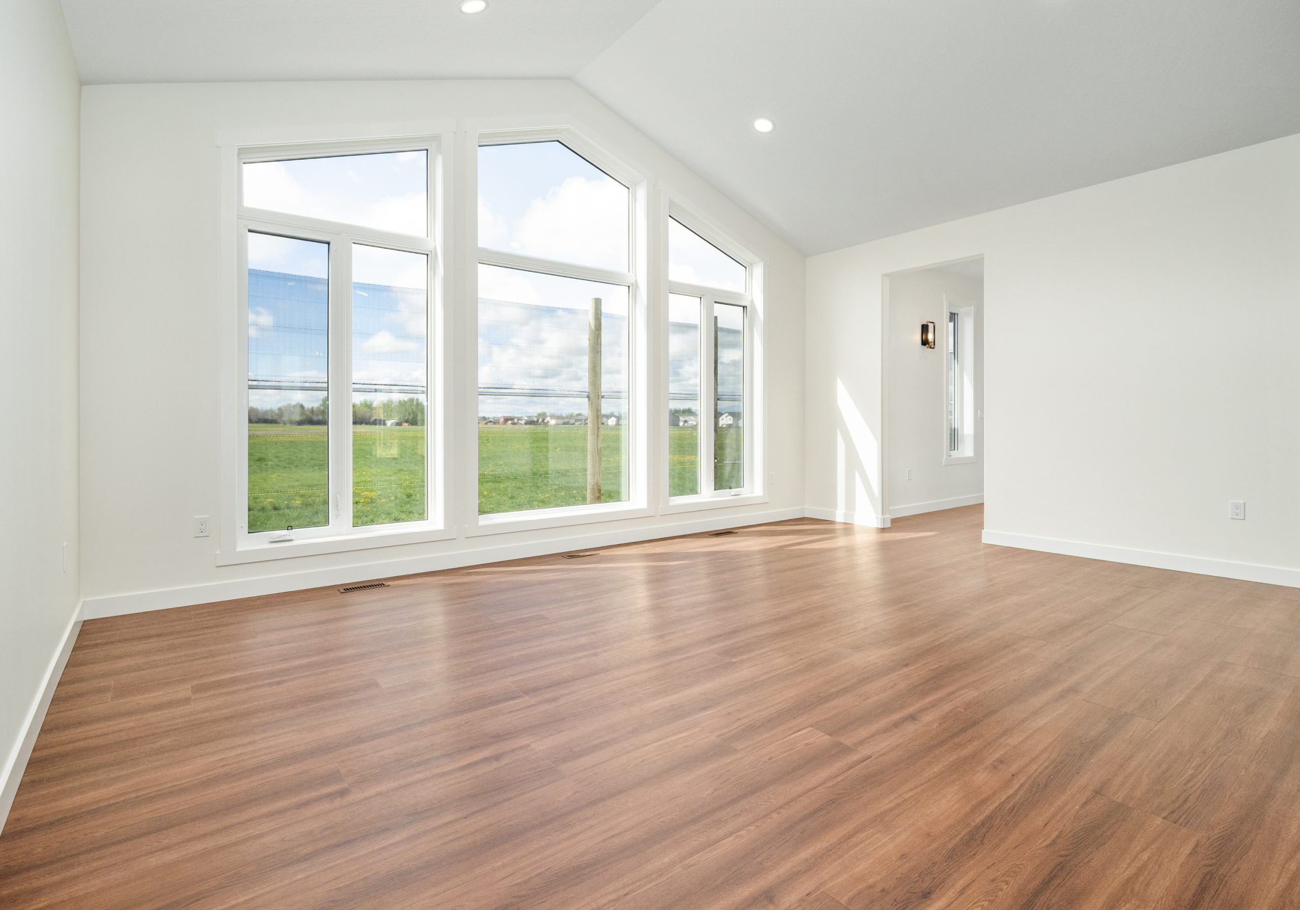 vaulted-ceiling-living-room-big-windows
